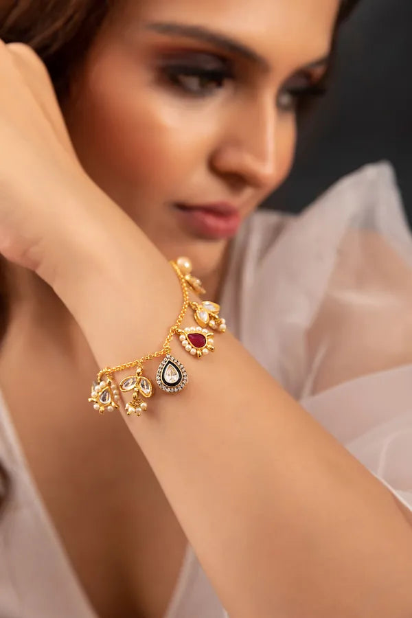 Gold Finish Pearls & Kundan Asymmetric Charm Bracelet