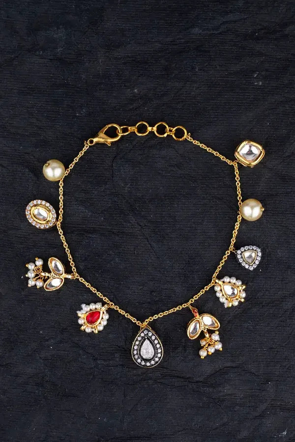 Gold Finish Pearls & Kundan Asymmetric Charm Bracelet
